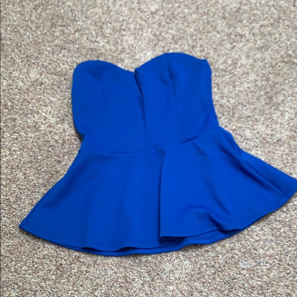 Blue peplum tube top.